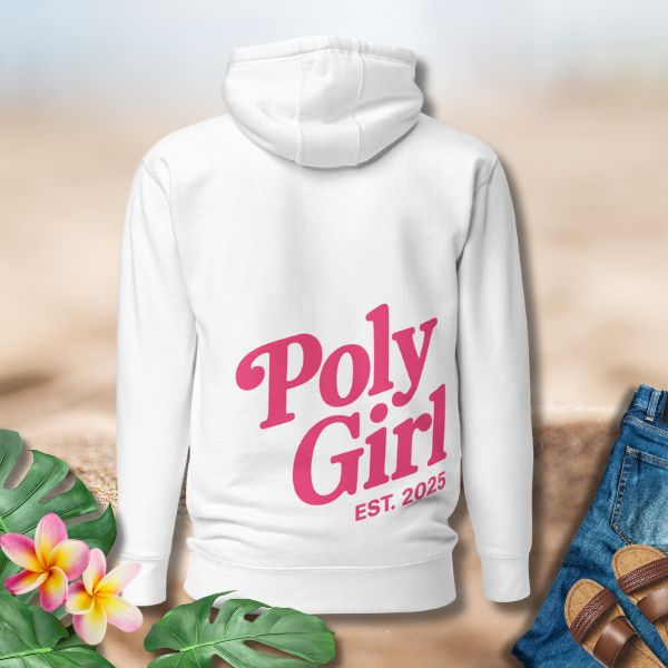 White hoodie with 'Poly Girl EST. 2025' text on a neutral background with flowers and jeans.
