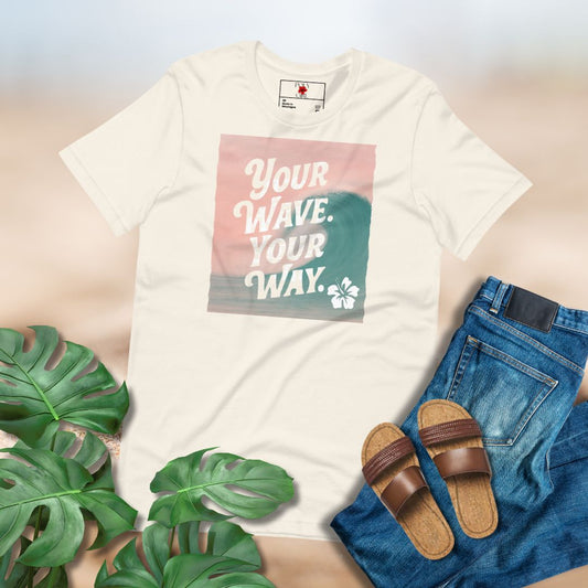 White t-shirt with 'Your Wave, Your Way' graphic, paired with jeans and sandals on a light background.