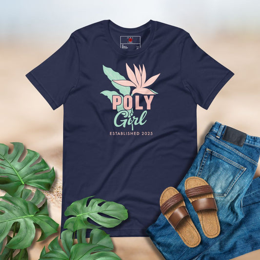 Navy blue t-shirt with 'Poly Girl' design, paired with jeans, sandals, and green leaves on a light background