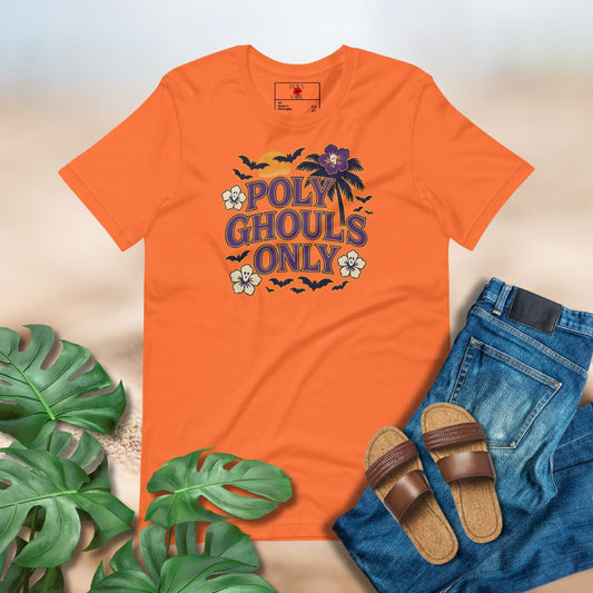Orange t-shirt with 'Poly Ghouls Only' design, paired with jeans and sandals on a neutral background.