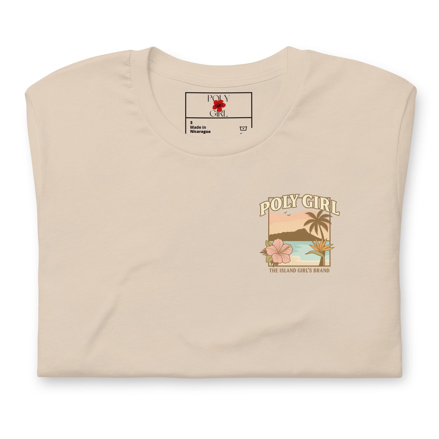 Folded Poly Girl t-shirt showing tropical sunset and flower design on front chest.