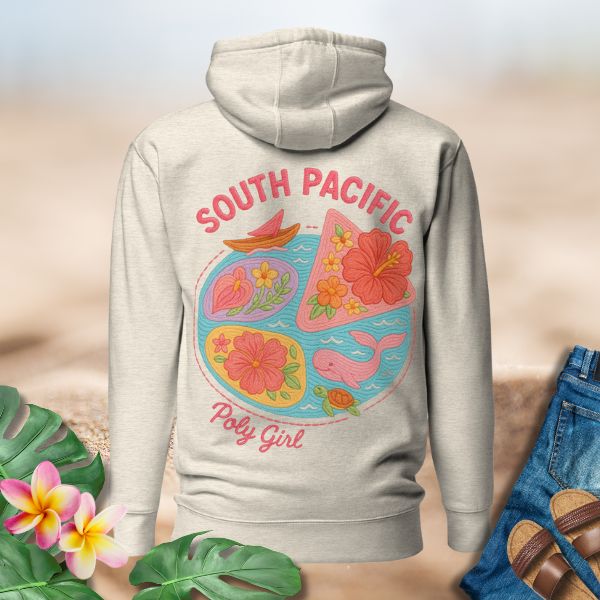 Close-up of South Pacific embroidery with hibiscus, whale, and canoe by Poly Girl