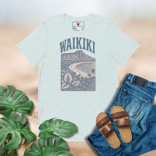 Light blue t-shirt with 'Waikiki' graphic design, paired with jeans and sandals on a neutral background.
